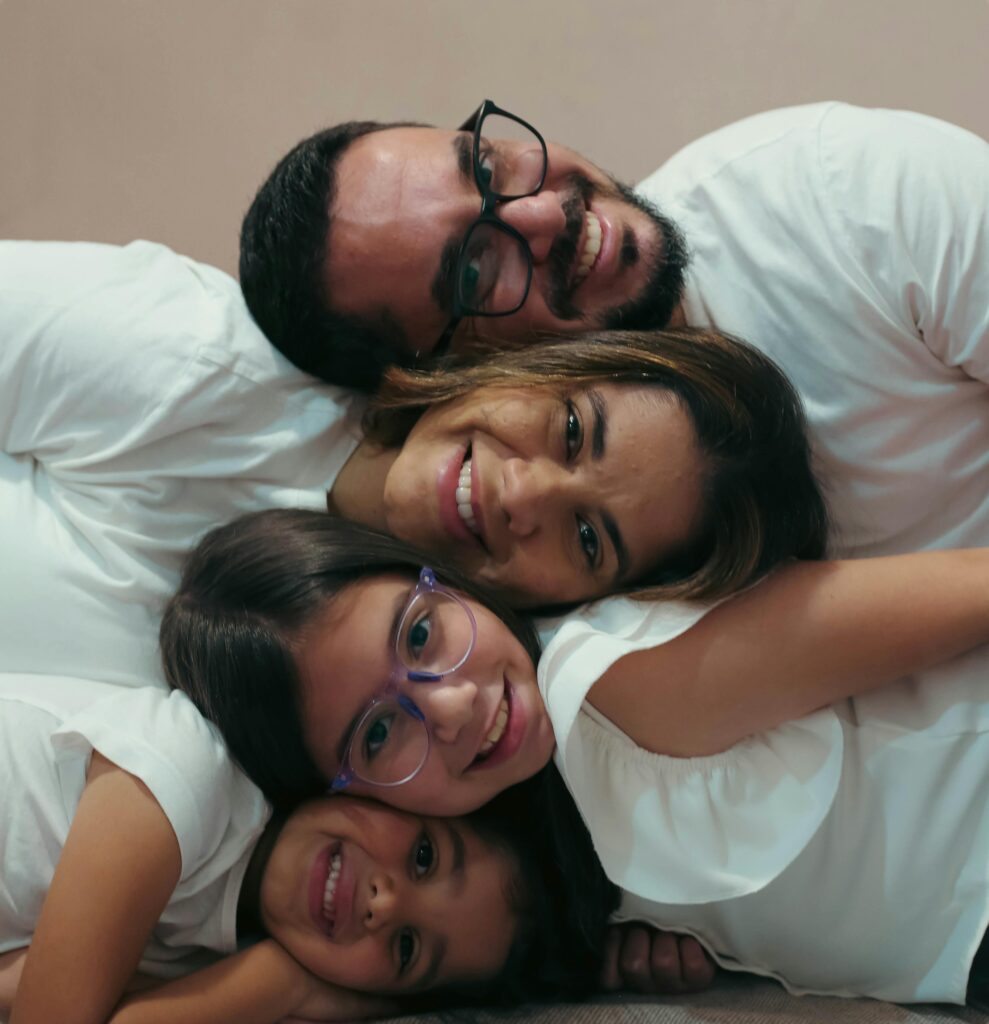 pexels-photo-35640969-35640969 Happy family of four cuddling together, capturing love and joy.